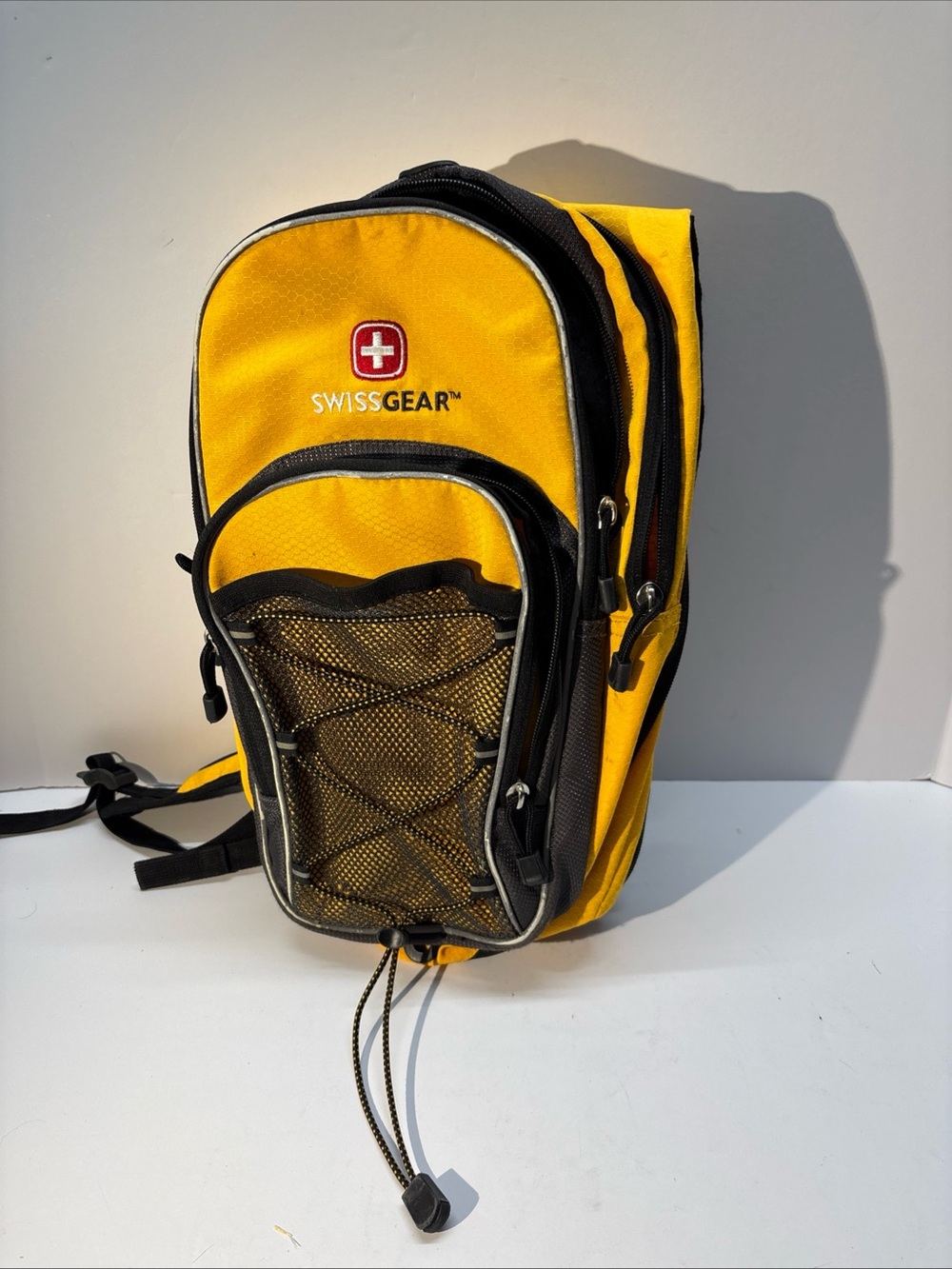 SwissGear unisex Yellow and Black Compact Daypack Backpack.